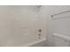 Bright bathroom with a clean white tub and shower combination and a water-efficient toilet at 5110 Chipstone Dr, Raleigh, NC 27610