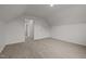 Bedroom with neutral walls and carpet features a doorway to another room at 5110 Chipstone Dr, Raleigh, NC 27610