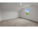 Bright and airy bedroom featuring a large window and neutral walls and carpet at 5110 Chipstone Dr, Raleigh, NC 27610
