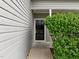 Close-up of the front door surrounded by greenery and siding at 5110 Chipstone Dr, Raleigh, NC 27610
