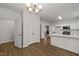 Open concept kitchen featuring modern cabinets and stainless appliances and adjacent dining area at 5110 Chipstone Dr, Raleigh, NC 27610