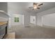 Cozy living space features carpet flooring, recessed lights, and an entry to the dining room at 5110 Chipstone Dr, Raleigh, NC 27610