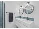 Modern bathroom featuring double sinks, stylish lighting, and a sleek design at 5232 Guess Rd, Durham, NC 27712
