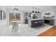 Bright kitchen featuring a center island with seating and access to a slider at 5232 Guess Rd, Durham, NC 27712