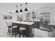 Stylish kitchen with gray cabinets, a large island, and modern stainless steel appliances at 5232 Guess Rd, Durham, NC 27712