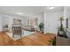 Bright living room with hardwood floors, neutral walls, and lots of natural light at 5232 Guess Rd, Durham, NC 27712