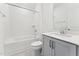 Bright bathroom featuring a shower/tub combination and modern single vanity with white countertops at 528 Gainer Dr # 8, Raleigh, NC 27610