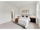 Neutral primary bedroom featuring carpet, a ceiling fan and a king sized bed and decorative lighting at 528 Gainer Dr # 8, Raleigh, NC 27610