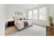 Spacious and bright primary bedroom features a large window, carpeting, and neutral decor at 528 Gainer Dr # 8, Raleigh, NC 27610