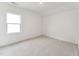 Bedroom with neutral decor, carpet, white walls, and a bright window at 528 Gainer Dr # 8, Raleigh, NC 27610