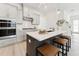 Modern kitchen featuring a center island with seating, stainless steel appliances, and sleek countertops at 528 Gainer Dr # 8, Raleigh, NC 27610