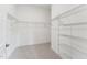 Walk-in closet features carpet and shelving for storage and organization at 528 Gainer Dr # 8, Raleigh, NC 27610