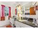 Well-lit bathroom with double vanities and modern fixtures at 5410 Thayer Dr, Raleigh, NC 27612