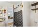 Bathroom featuring a vanity with a dark countertop and a patterned shower curtain at 5410 Thayer Dr, Raleigh, NC 27612