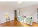 Bright bedroom featuring wood floors, a daybed with storage drawers, and a neutral color palette at 5410 Thayer Dr, Raleigh, NC 27612