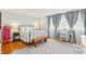 Bright bedroom featuring a metal frame bed and a vanity table at 5410 Thayer Dr, Raleigh, NC 27612