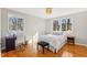 Sunlit bedroom with a single bed and a writing desk, perfect for relaxation at 5410 Thayer Dr, Raleigh, NC 27612