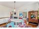 Charming dining room features unique colorful chairs and decor at 5410 Thayer Dr, Raleigh, NC 27612