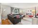 Inviting living room with a comfortable gray sectional and a stylish rug at 5410 Thayer Dr, Raleigh, NC 27612
