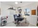 Bright and functional home office with natural light, ample shelving, and a comfortable workspace at 5410 Thayer Dr, Raleigh, NC 27612