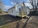 A charming home featuring a backyard deck and convenient access to the back door at 611 Rowland St, Henderson, NC 27536