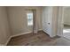 Bedroom with wood flooring and neutral walls at 611 Rowland St, Henderson, NC 27536