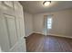 Cozy bedroom with modern wood flooring and natural light at 611 Rowland St, Henderson, NC 27536