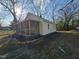 Charming house with screened in porch and rock landscaping at 611 Rowland St, Henderson, NC 27536