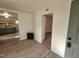 Inviting living room with wood floors, fireplace, and view of the updated kitchen at 611 Rowland St, Henderson, NC 27536