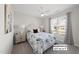 Comfortable bedroom with natural light, ceiling fan and neutral color scheme at 612 Sweet Pine Ln, Knightdale, NC 27545