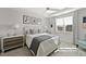 Serene bedroom with a ceiling fan and a large window with natural light at 612 Sweet Pine Ln, Knightdale, NC 27545