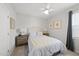 Comfortable bedroom features neutral walls, ceiling fan, and natural light at 612 Sweet Pine Ln, Knightdale, NC 27545