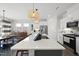 Bright kitchen with a large center island, modern appliances, and pendant lighting at 612 Sweet Pine Ln, Knightdale, NC 27545