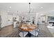Open floor plan combining dining, kitchen and living spaces with lots of natural light at 612 Sweet Pine Ln, Knightdale, NC 27545