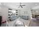 Open and inviting living room featuring neutral décor, comfortable seating, and a view into the dining area at 612 Sweet Pine Ln, Knightdale, NC 27545