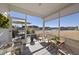 Inviting screened-in porch featuring comfortable seating, a ceiling fan, and neighborhood views at 612 Sweet Pine Ln, Knightdale, NC 27545