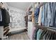 Bright walk-in closet with custom shelving, modern storage solutions, and laminate flooring at 612 Sweet Pine Ln, Knightdale, NC 27545