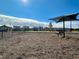 Community dog park with shaded seating area at 617 Leland Hl Cir, Zebulon, NC 27597