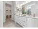 Bright bathroom featuring double vanity sinks and modern finishes, plus a walk-in closet at 632 Gainer Dr # 19, Raleigh, NC 27610