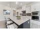 Stylish kitchen with a large island, stainless steel appliances, and white cabinetry at 632 Gainer Dr # 19, Raleigh, NC 27610