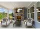 Relaxing outdoor patio with a stone fireplace and comfortable seating area at 632 Gainer Dr # 19, Raleigh, NC 27610