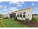 Landscaped backyard featuring a well-maintained lawn, a screened-in porch, and mature plantings at 640 Gainer Dr # 21, Raleigh, NC 27610
