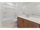 Bathroom featuring single vanity with wood cabinet, toilet, and a bathtub with white tile surround at 640 Gainer Dr # 21, Raleigh, NC 27610