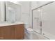 Bathroom featuring single vanity with wood cabinet, toilet, and a glass-enclosed shower with white tile at 640 Gainer Dr # 21, Raleigh, NC 27610