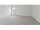 Bright bedroom featuring a carpeted floor, white walls, and a window providing natural light at 640 Gainer Dr # 21, Raleigh, NC 27610