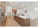 Gourmet kitchen featuring a center island with breakfast bar, stainless steel appliances, and custom cabinetry at 640 Gainer Dr # 21, Raleigh, NC 27610