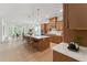 Open-concept kitchen boasting a large island with seating, stainless steel appliances, and modern lighting at 640 Gainer Dr # 21, Raleigh, NC 27610