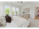 Spacious primary bedroom featuring large windows, a ceiling fan, and neutral decor at 640 Gainer Dr # 21, Raleigh, NC 27610