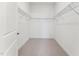 Empty walk-in closet ready for your customization with shelving at 640 Gainer Dr # 21, Raleigh, NC 27610