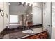 This bathroom features double sinks with granite countertop and a glass shower at 10014 Hammock Bend Bnd, Chapel Hill, NC 27517